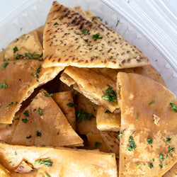 View of Open Container of Baba Small Batch Pita Chips. Get ready to crunch!